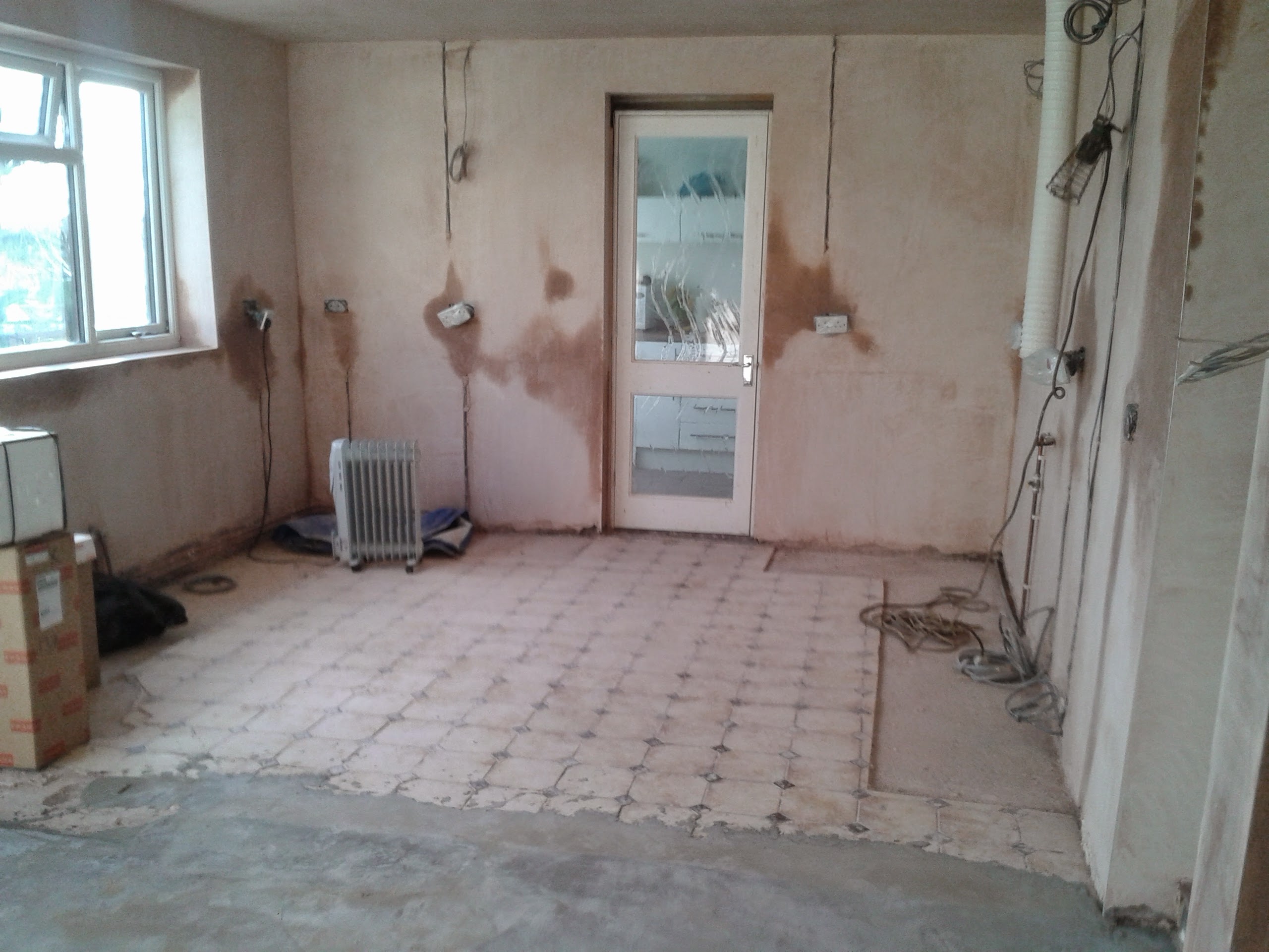 Existing kitchen out, walls and ceilings re plastered